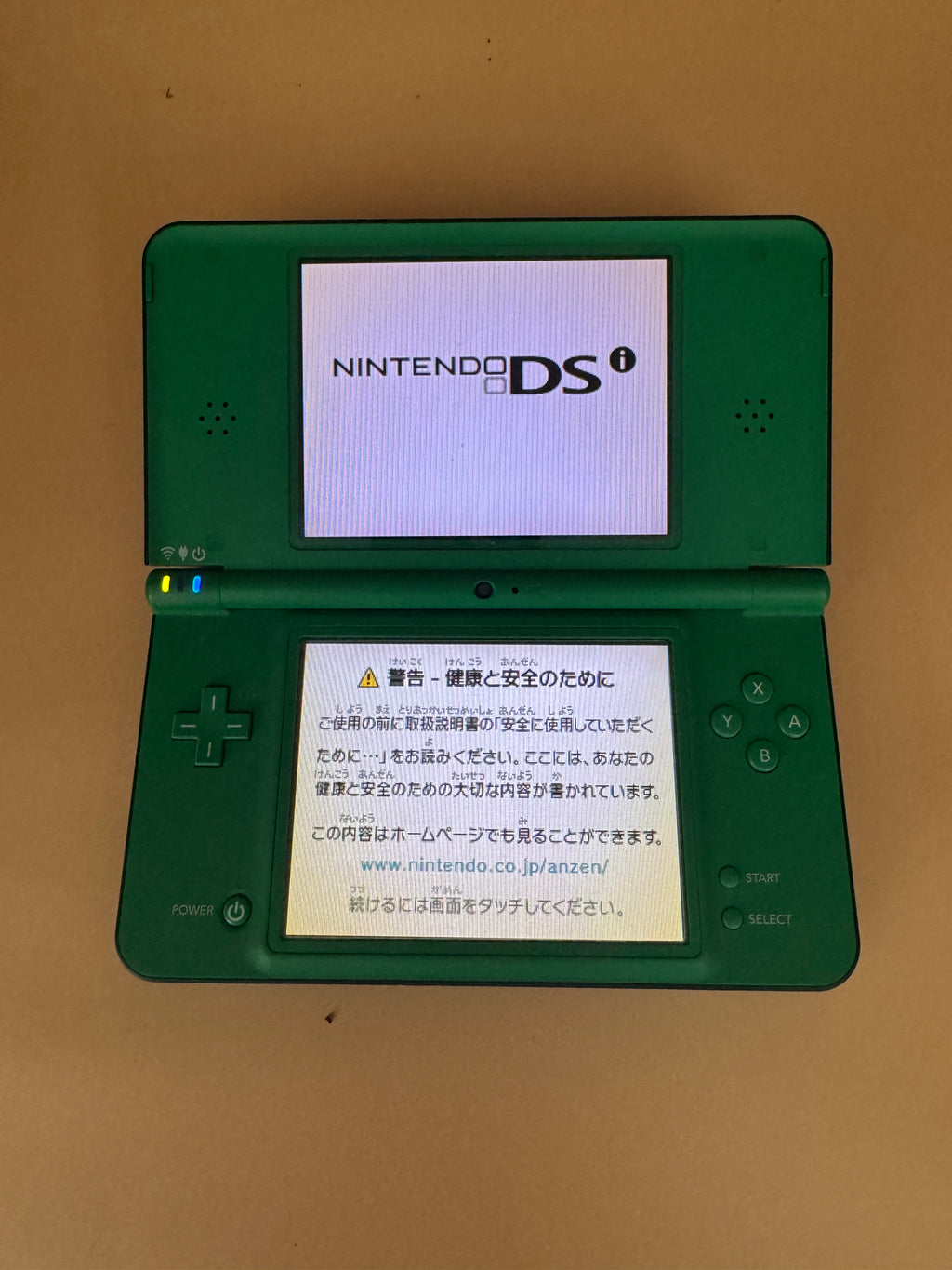 Green Nintendo DSi XL/LL (Japanese import-plays English games in English)