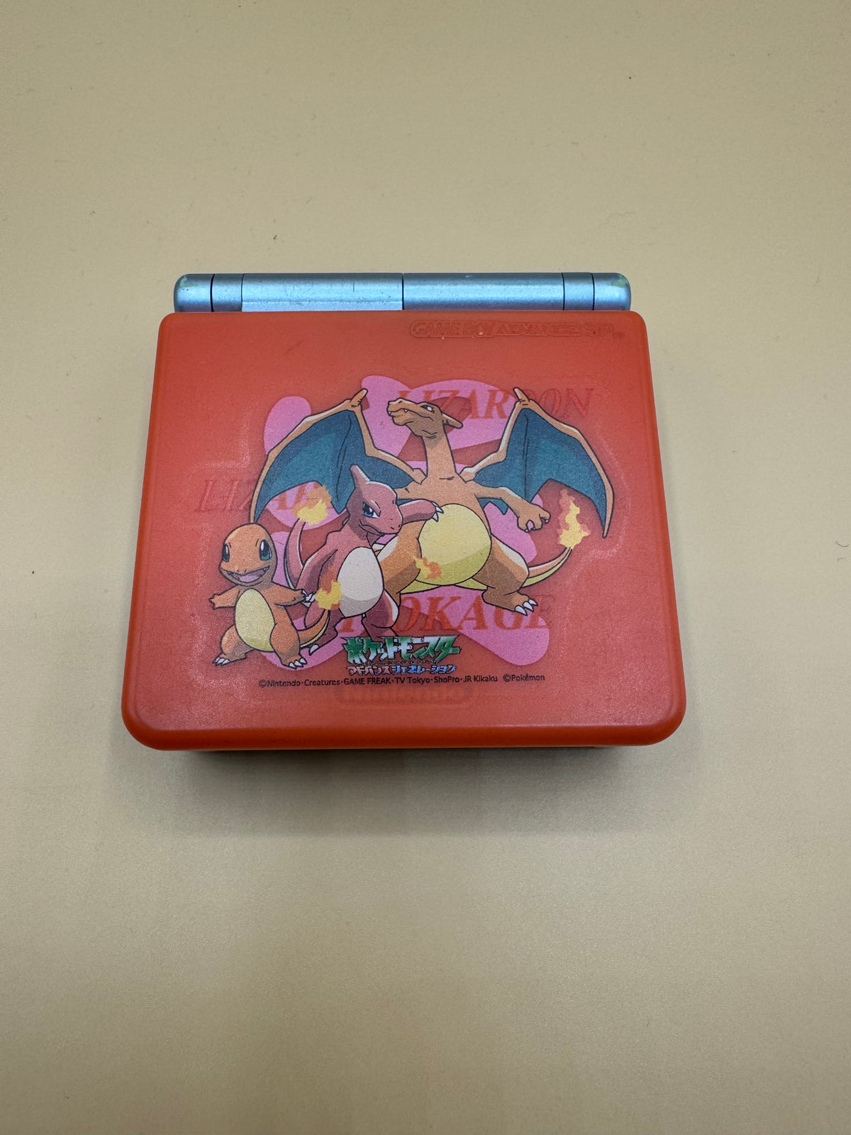 Gameboy Advance SP-101 with Charizard Evolution hard case